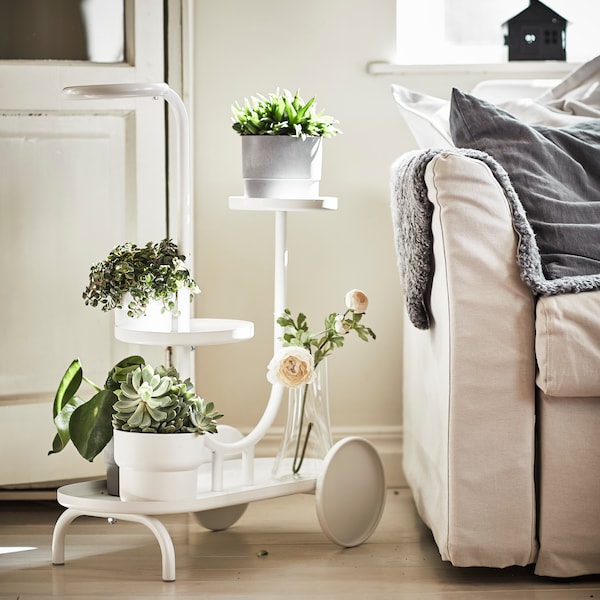 A white CHILISTRÅN plant stand with wheels