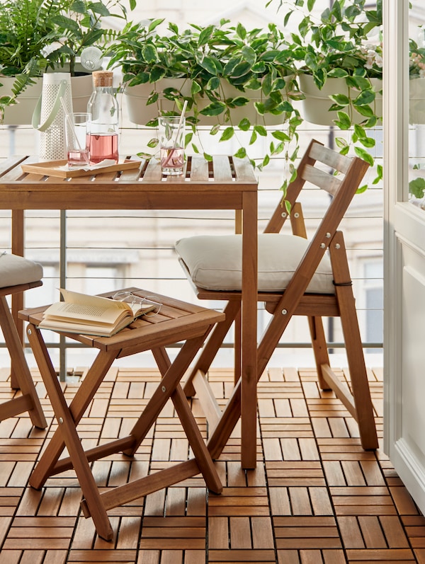 A light brown stained NÄMMARÖ table, outdoor